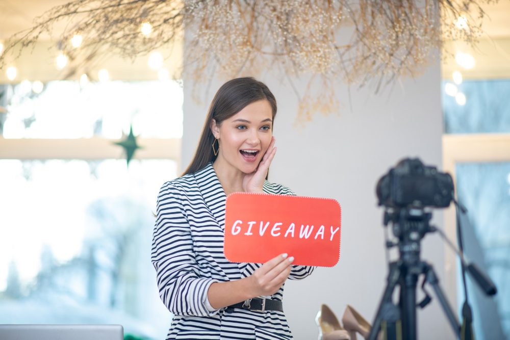 Hold a Contest or Giveaway - Business owner announcing a giveaway contest