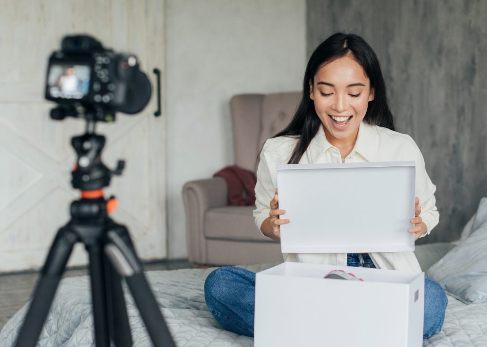 Offer an Affiliate or Ambassador Program - A brand ambassador opening a PR package
