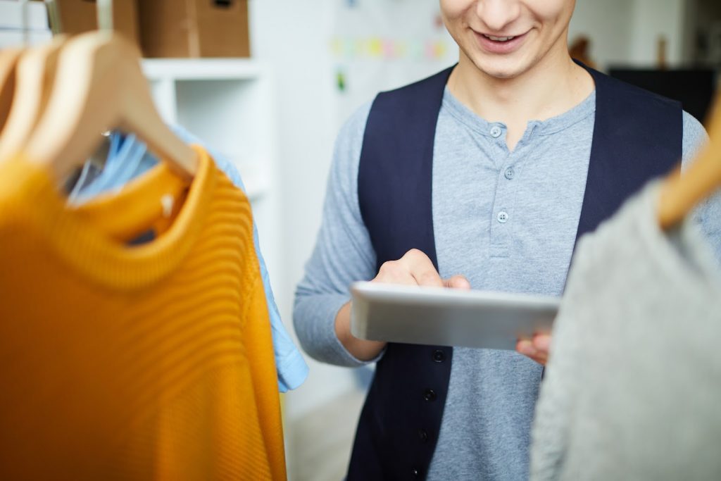 Engage on Social Media - Businessowner interacting with her business's online followers