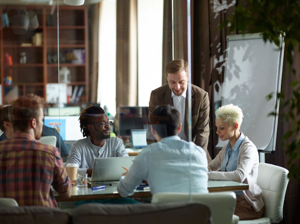 a man presenting documents at a meeting
